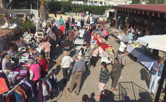 People examining stalls at the Miraflores market day