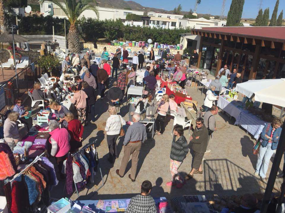 People examining stalls at the Miraflores market day